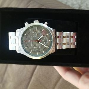 Men's Melbourne watch, new in case with tags and plastic, and never worn.